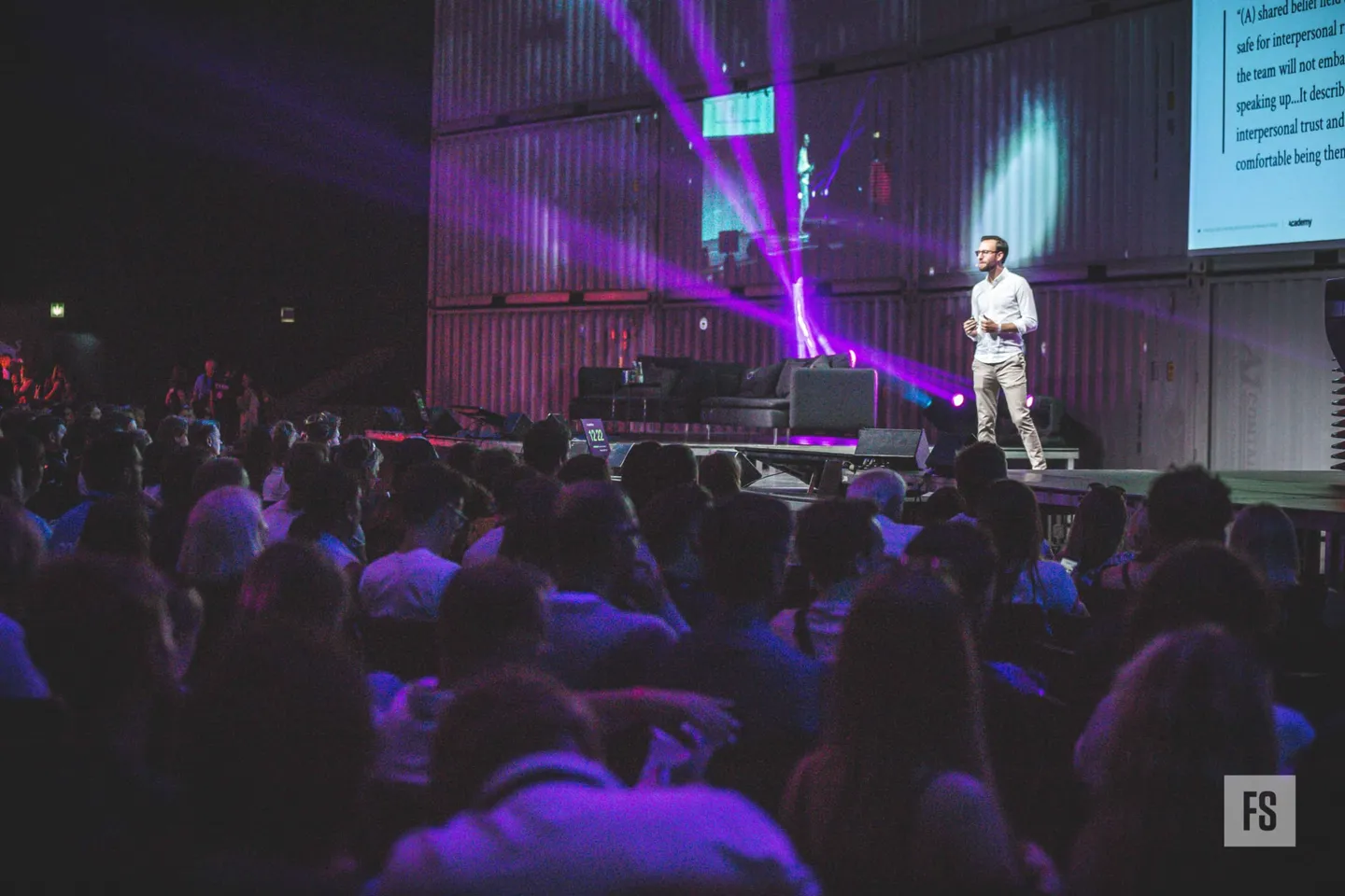 Adam on stage at Fifteen Seconds Festival in Graz, in front of a full hall